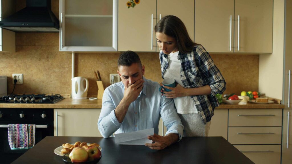 Two landlords looking surprised by hidden fees charged by a traditional property management company.